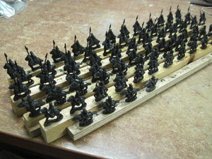 Mongol light and heavy cavalry sprayed satin black and mounted on strips of wood ready for painting