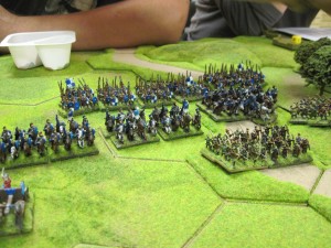 British cavalry and spears sit astride the central road, archers to the fore