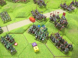 Outnumbered 3:1, a unit of Tudor mounted men at arms holds its ground with an excellent di roll to temporarily slow the Yorkist attack.
